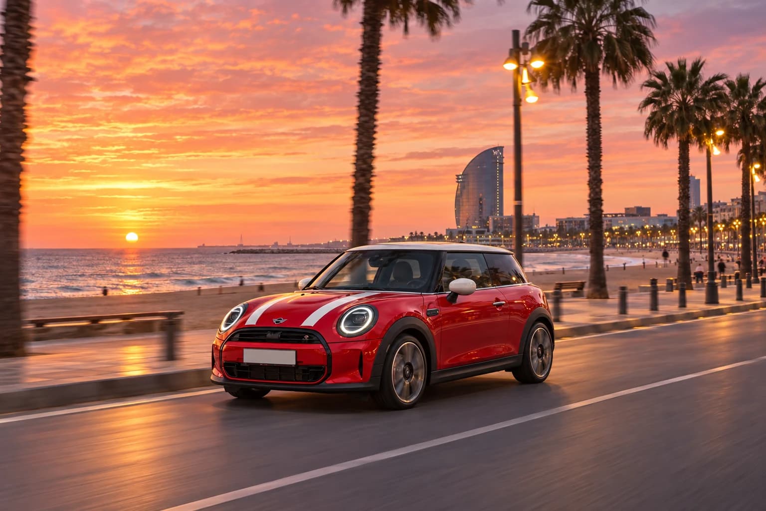 MINI rojo junto al paseo marítimo de la Barceloneta al atardecer